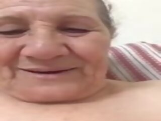 An old woman videos herself